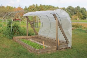 A DIY season extension structure shaped like a clamshell