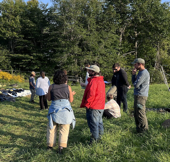 A group of beginning farmers attend a farm tour.
